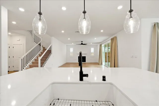 a kitchen with granite countertop a stove and a microwave