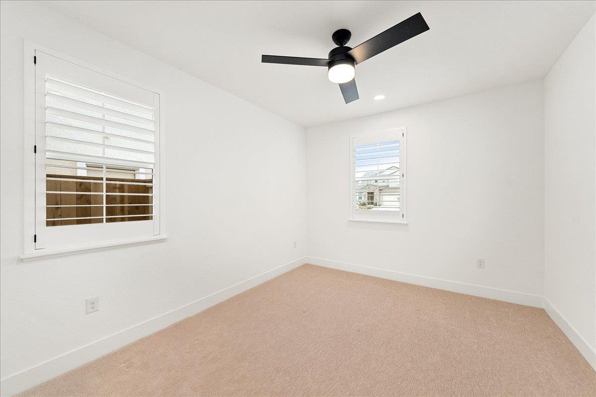 280 Vectra Court Roseville, CA 95747 - Photo 26 of 84 an empty room with a window and a ceiling fan