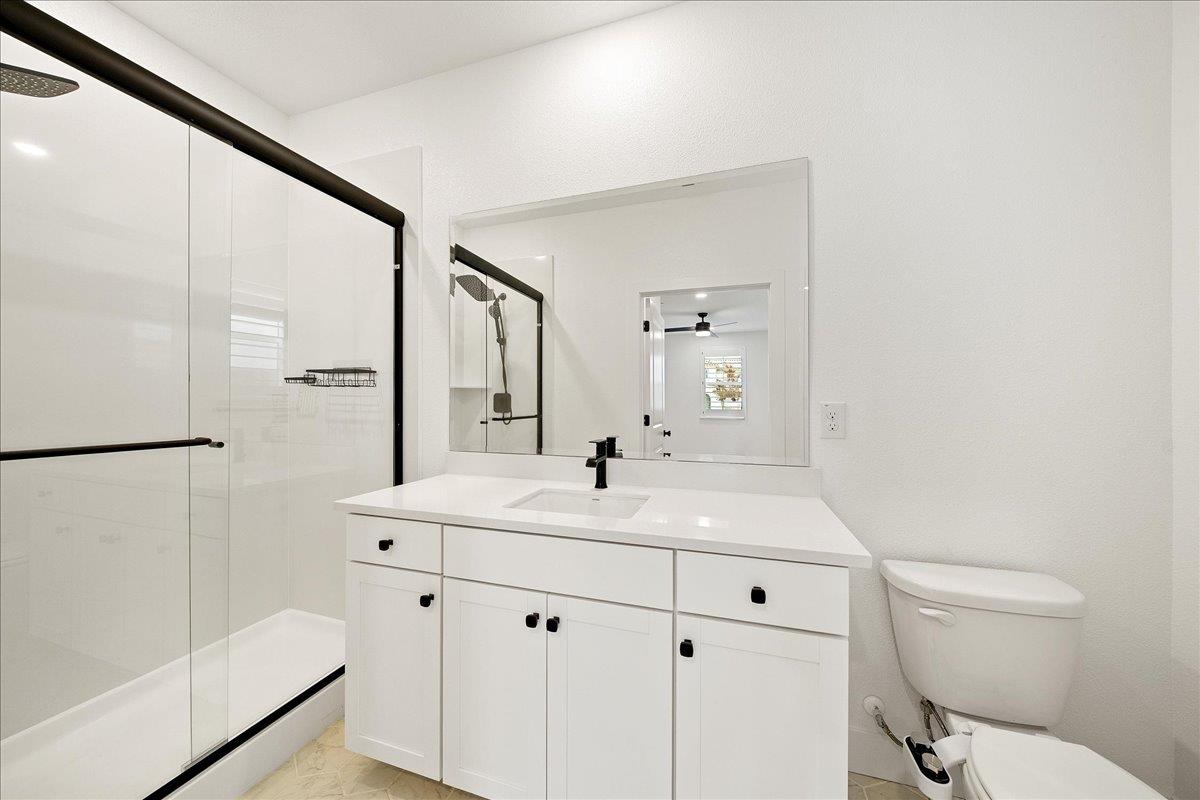 280 Vectra Court Roseville, CA 95747 - Photo 28 of 84 a bathroom with a sink a toilet and a mirror