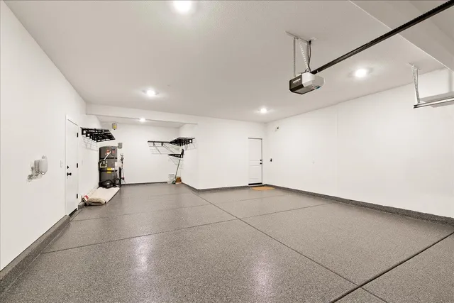 a spacious bathroom with a large tub shower and windows