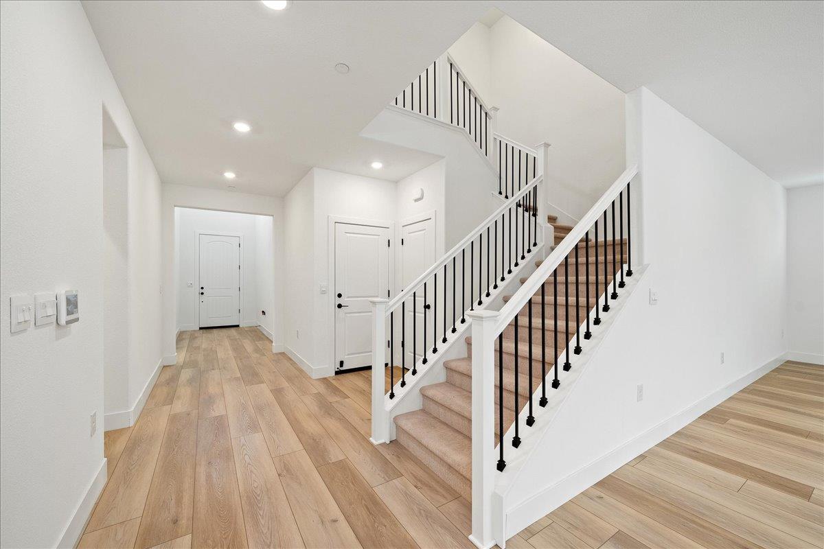 280 Vectra Court Roseville, CA 95747 - Photo 31 of 84 a view of a hallway with wooden floor and staircase