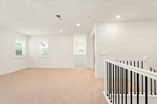 a white toilet sitting next to a bath tub