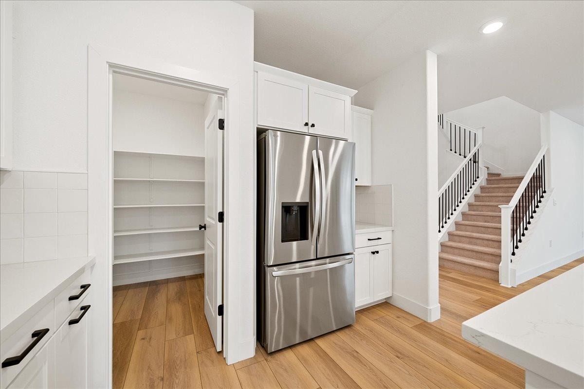 280 Vectra Court Roseville, CA 95747 - Photo 40 of 84 a view of a kitchen with wooden floor and electronic appliances