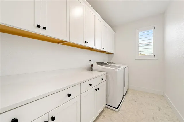 a view of a garden with a wooden fence