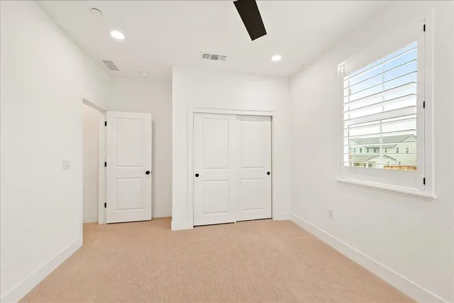 a view of a house with a yard and deck