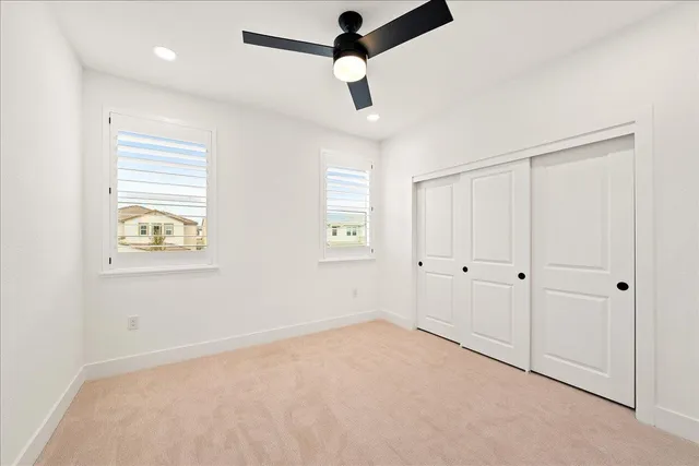 a front view of a house with a garden and yard