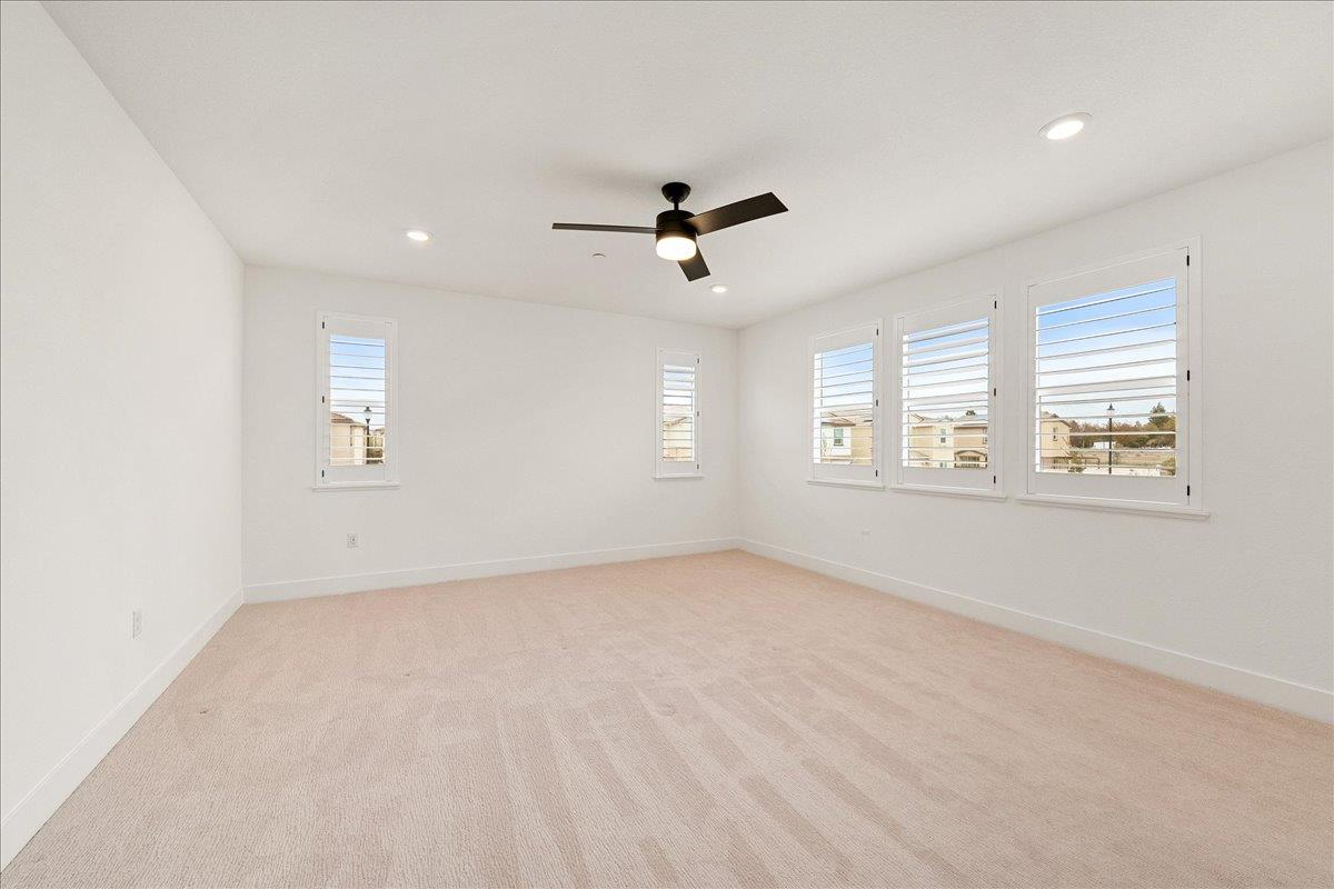 280 Vectra Court Roseville, CA 95747 - Photo 50 of 84 an empty room with windows and ceiling fan