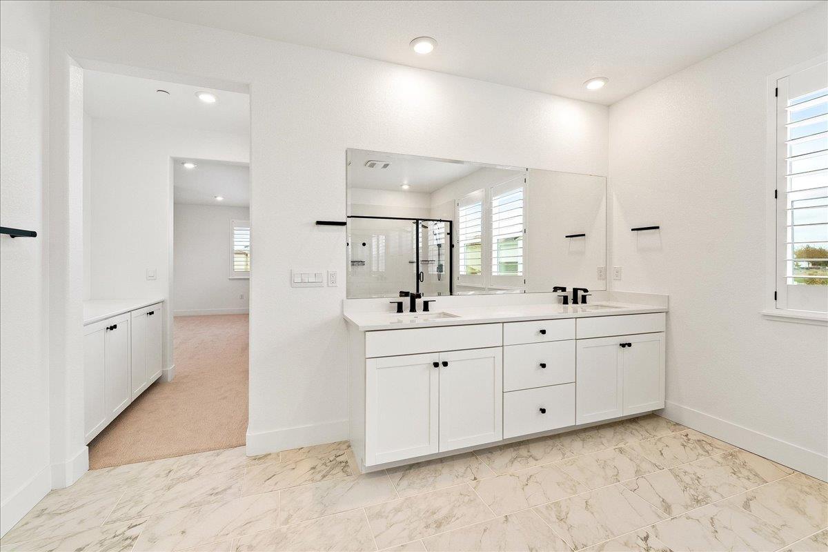 280 Vectra Court Roseville, CA 95747 - Photo 54 of 84 a spacious bathroom with a granite countertop sink mirror and a