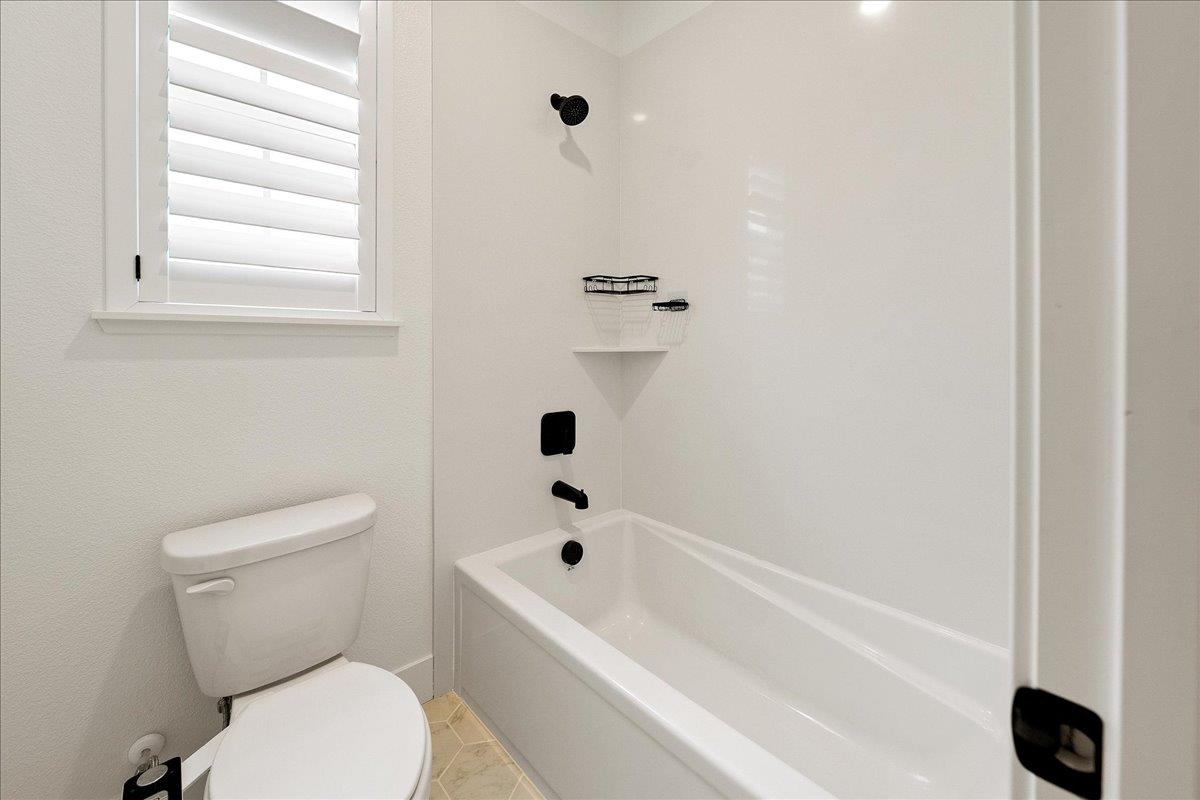 280 Vectra Court Roseville, CA 95747 - Photo 57 of 84 a white toilet sitting next to a bath tub