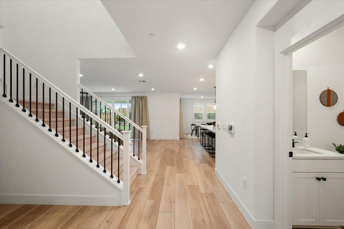 280 Vectra Court Roseville, CA 95747 - Photo 80 of 84 a view of a hallway with wooden floor and windows