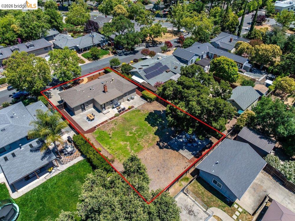 346 Valley View Road Pleasant Hill, CA 94523 - Photo 52 of 57 Expansive property featuring a single-story residence with a gray shingle roof and brick chimney