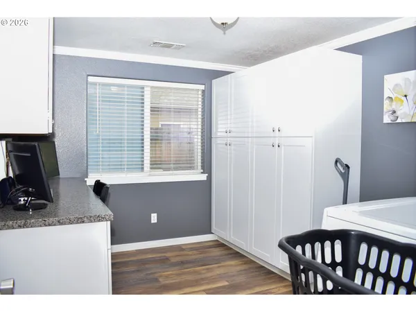 a view of a livingroom with furniture and a window