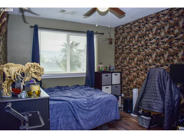 a living room with furniture rug and wooden floor