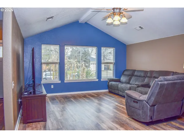 a living room with furniture and a window