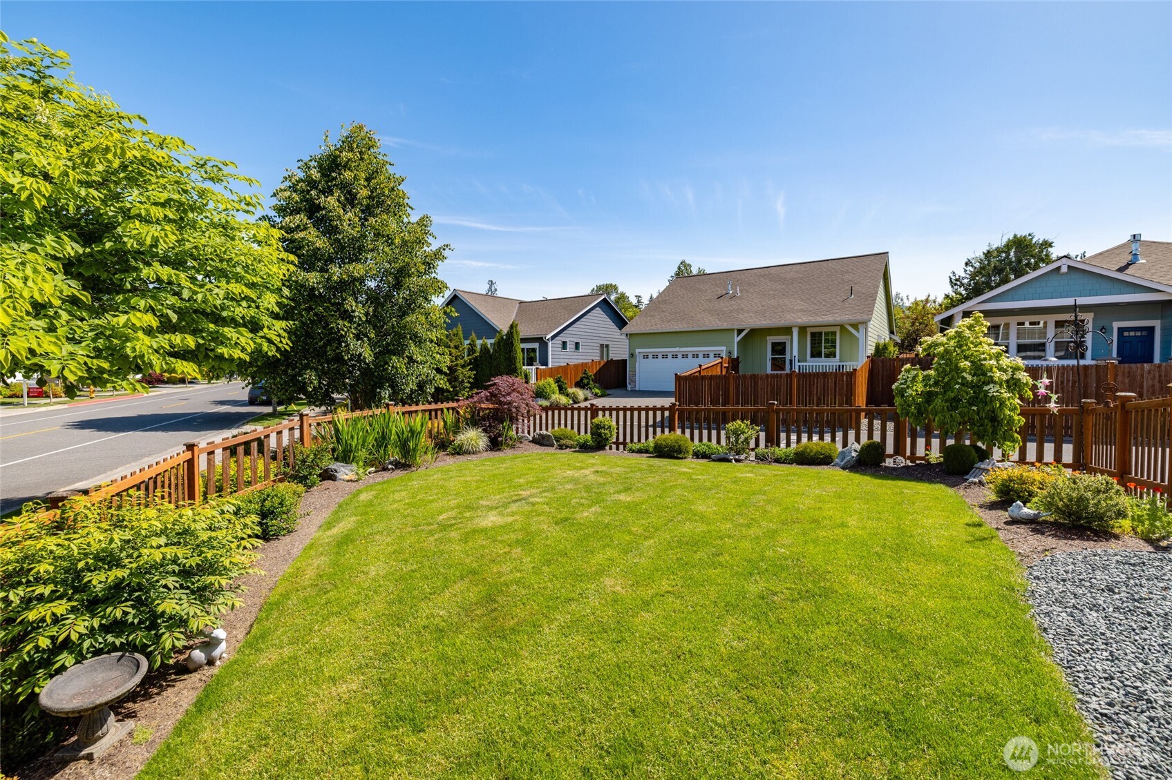 232 Sinclair Alley Mount Vernon, WA 98274 - Photo 23 of 33 a front view of a house with a yard table and chairs