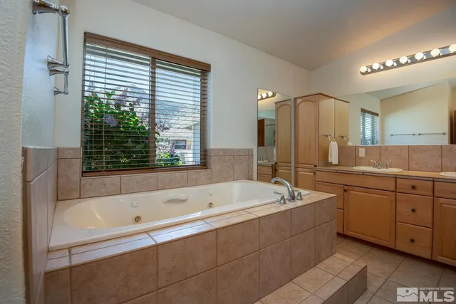 a bathroom with a bathtub and a sink