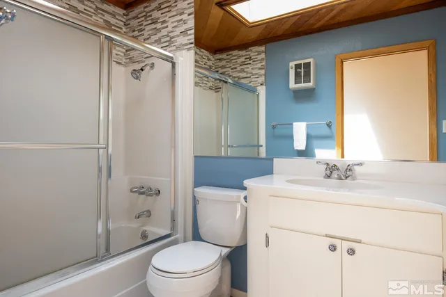 a view of a livingroom with furniture and a fireplace