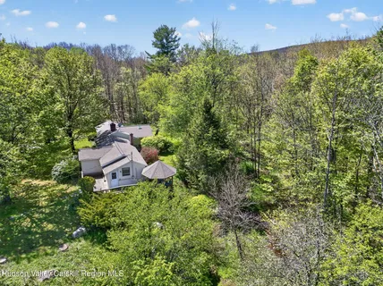 a view of a yard and mountain view