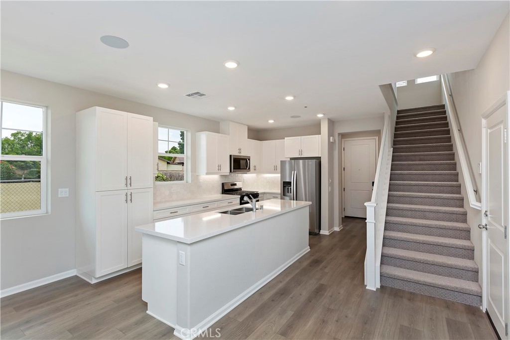7179 Rindle Lane Riverside, CA 92503 - Photo 10 of 21 a kitchen with refrigerator and cabinets