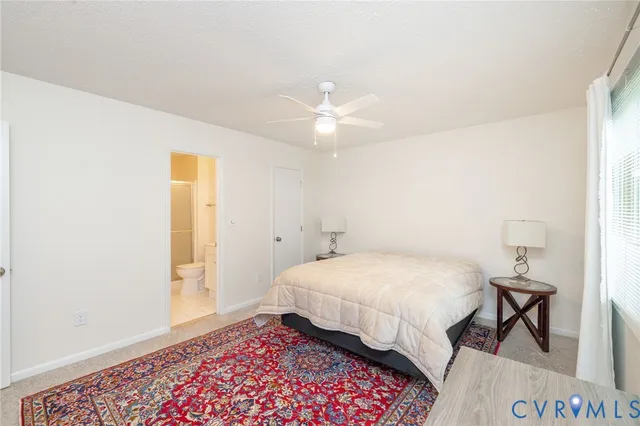 a bedroom with a bed and a table in it