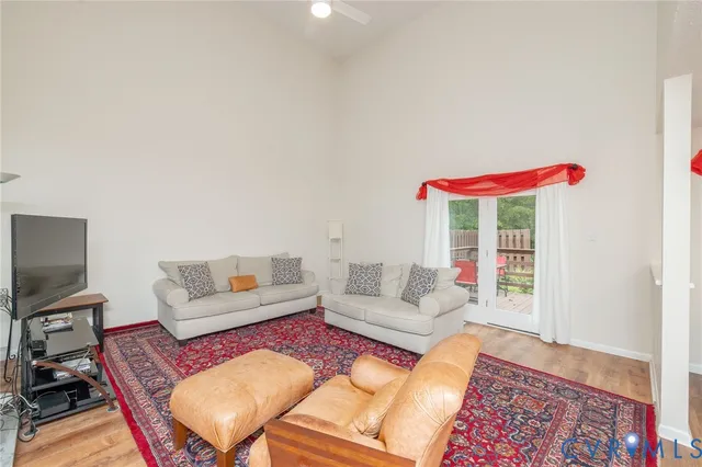 a living room with furniture and a rug