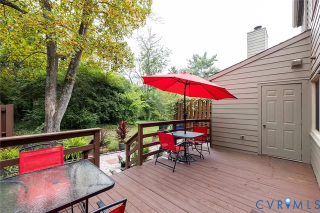 a view of a house with yard and sitting area
