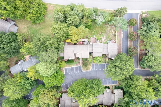 an aerial view of a house with yard and outdoor seating