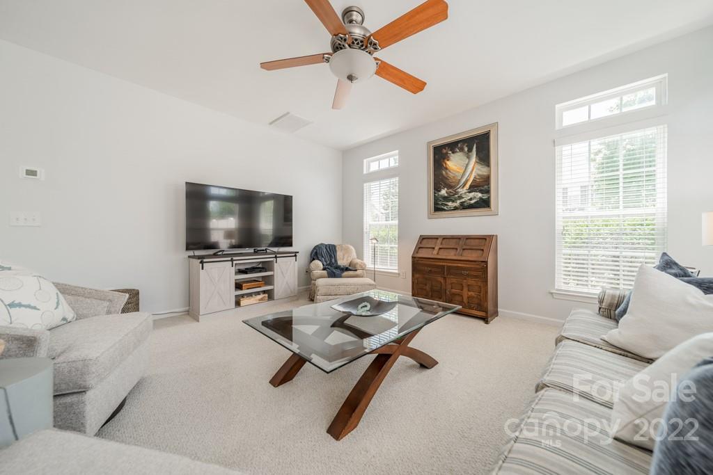 194 Snead Road Fort Mill, SC 29715 - Photo 8 of 43 a living room with furniture a flat screen tv and a window