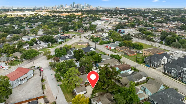 an aerial view of residential houses with outdoor space