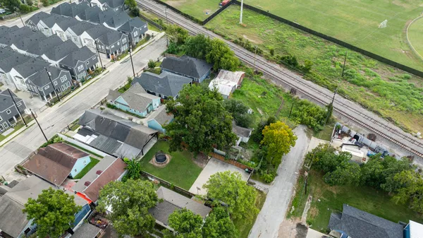 an aerial view of house with yard