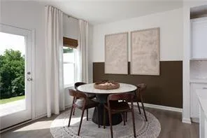 a dining room with furniture and window