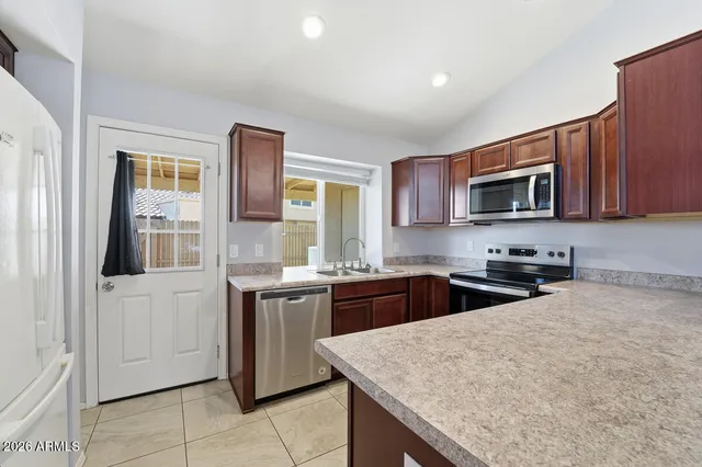 a view of a livingroom with a ceiling fan and window