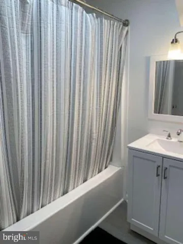 a bathroom with a sink and mirror