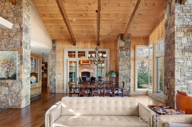a living room with lots of furniture and a chandelier