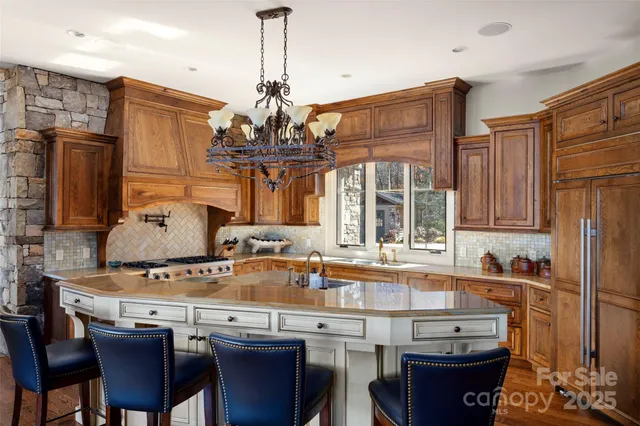 a kitchen with a sink stove and microwave