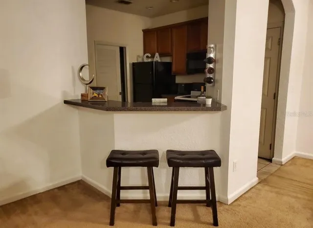 a view of a livingroom with a staircase