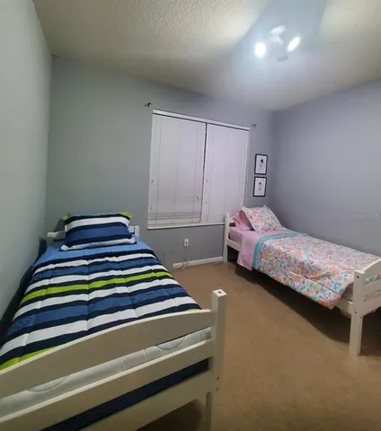 a kitchen with stainless steel appliances a refrigerator and a stove top oven