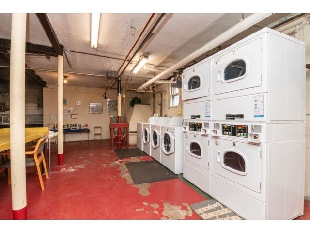 a view of a living room with washer and dryer