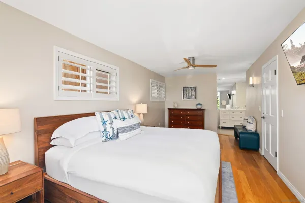a bedroom with a bed and a couch
