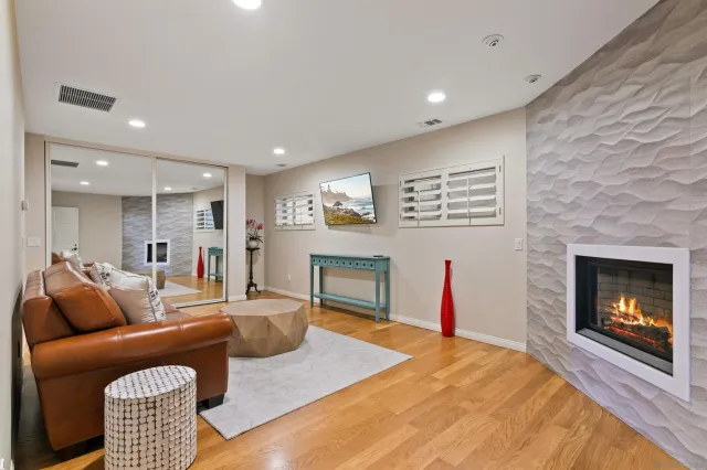 a living room with furniture and a fireplace