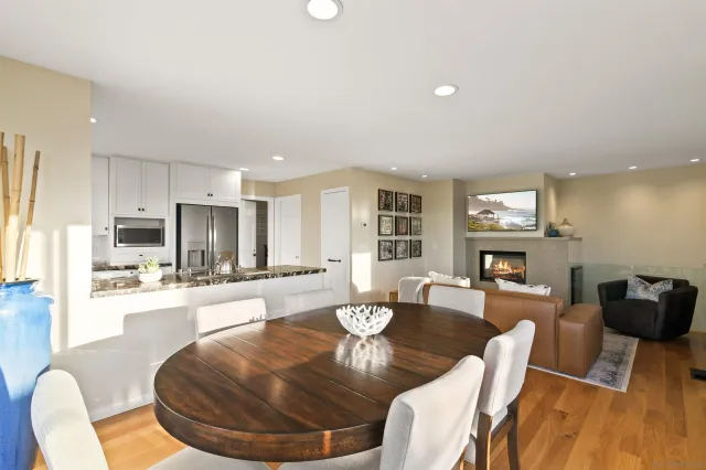 a living room with fireplace furniture and a wooden floor