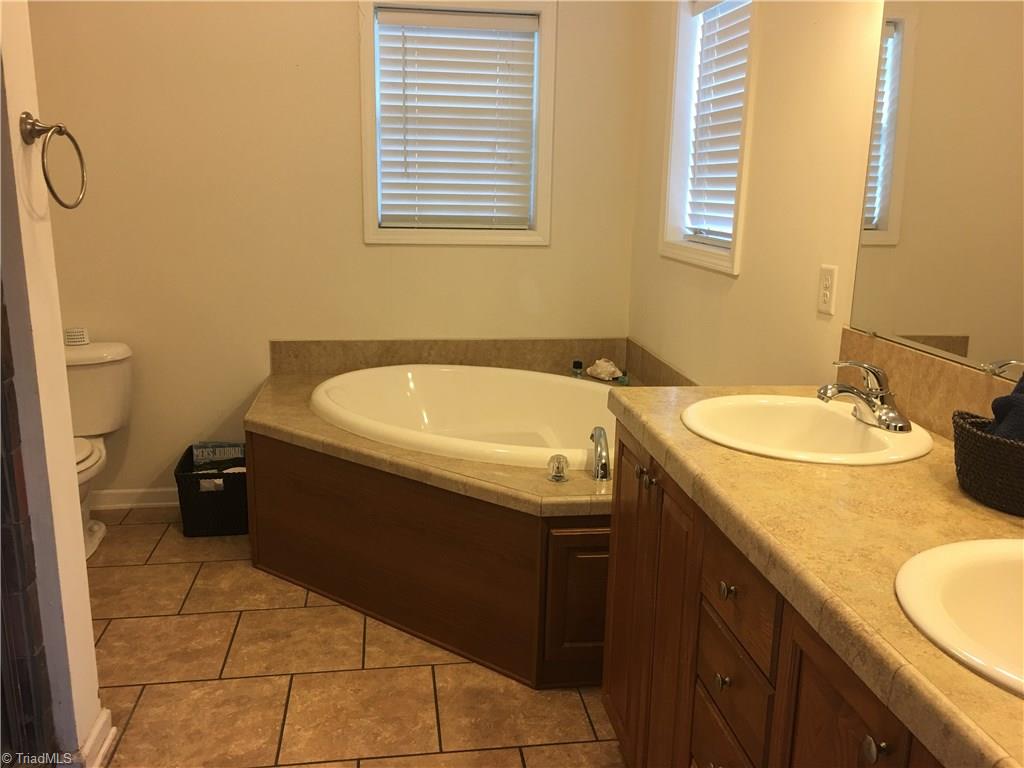 2089 Griffin Road Rural Hall, NC 27045 - Photo 12 of 30 Spacious Master bath with double vanity, large slate tiled shower.
