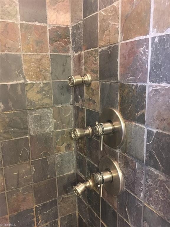 2089 Griffin Road Rural Hall, NC 27045 - Photo 13 of 30 Slate tiled shower with front and back jetted faucets.