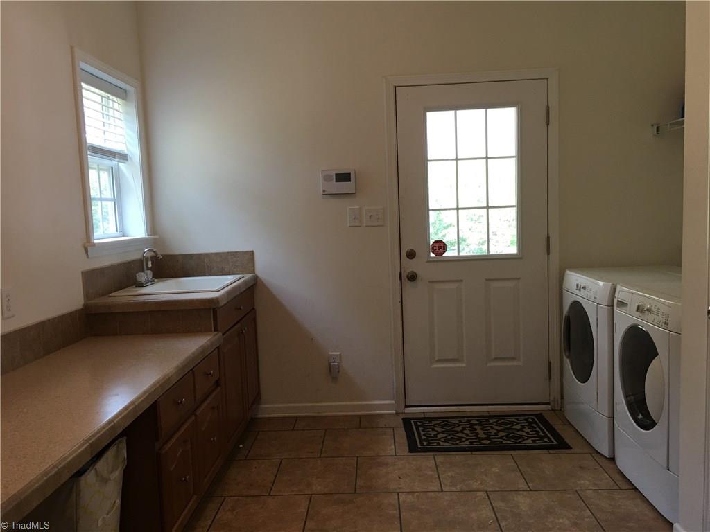 2089 Griffin Road Rural Hall, NC 27045 - Photo 17 of 30 Laundry room has entrance from the carport and has plenty of space for storage, craft area, or office.