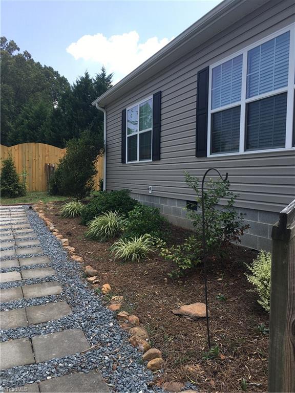 2089 Griffin Road Rural Hall, NC 27045 - Photo 20 of 30 Front of home has nice sidewalk and beautiful landscaping.