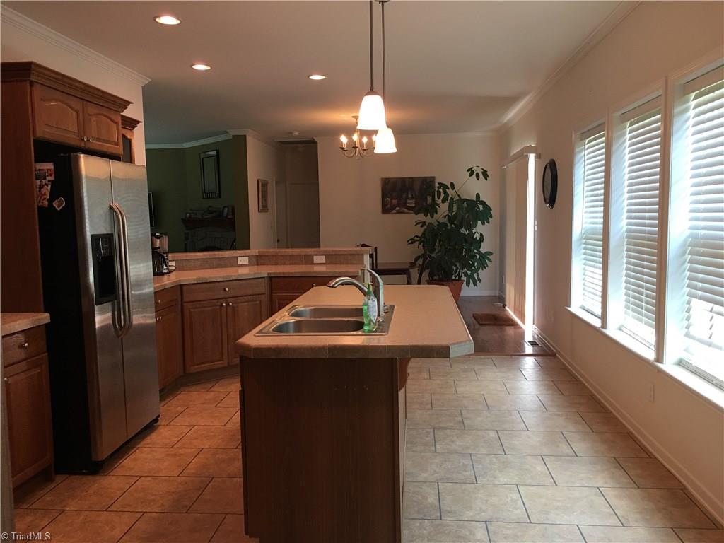 2089 Griffin Road Rural Hall, NC 27045 - Photo 30 of 30 Notice both bars areas in the kitchen have plenty of room for big family gatherings. The Dining room also offers plenty of room with this open floor plan.