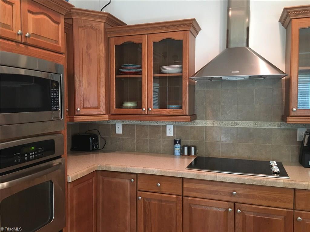 2089 Griffin Road Rural Hall, NC 27045 - Photo 5 of 30 This spacious kitchen has Stainless steel appliances, cook top and lots of storage.