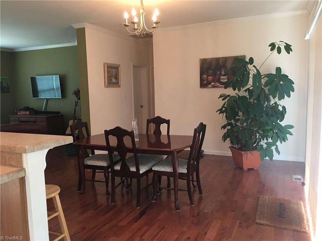 2089 Griffin Road Rural Hall, NC 27045 - Photo 7 of 30 Beautiful new hardwood flooring in dining room and living room.