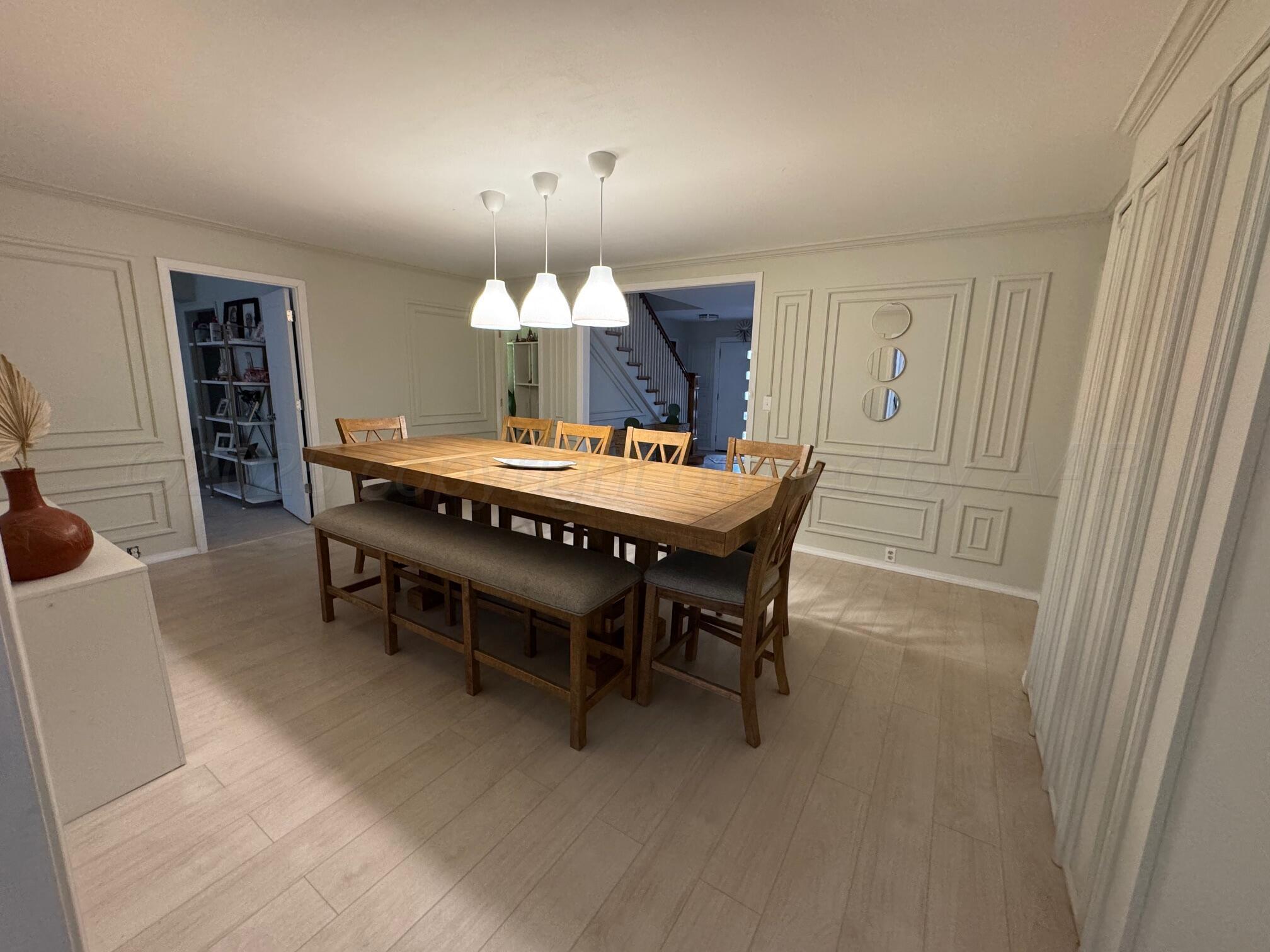 513 South Eton Street Perryton, TX 79070 - Photo 18 of 72 a dining room with furniture and chandelier kitchen view