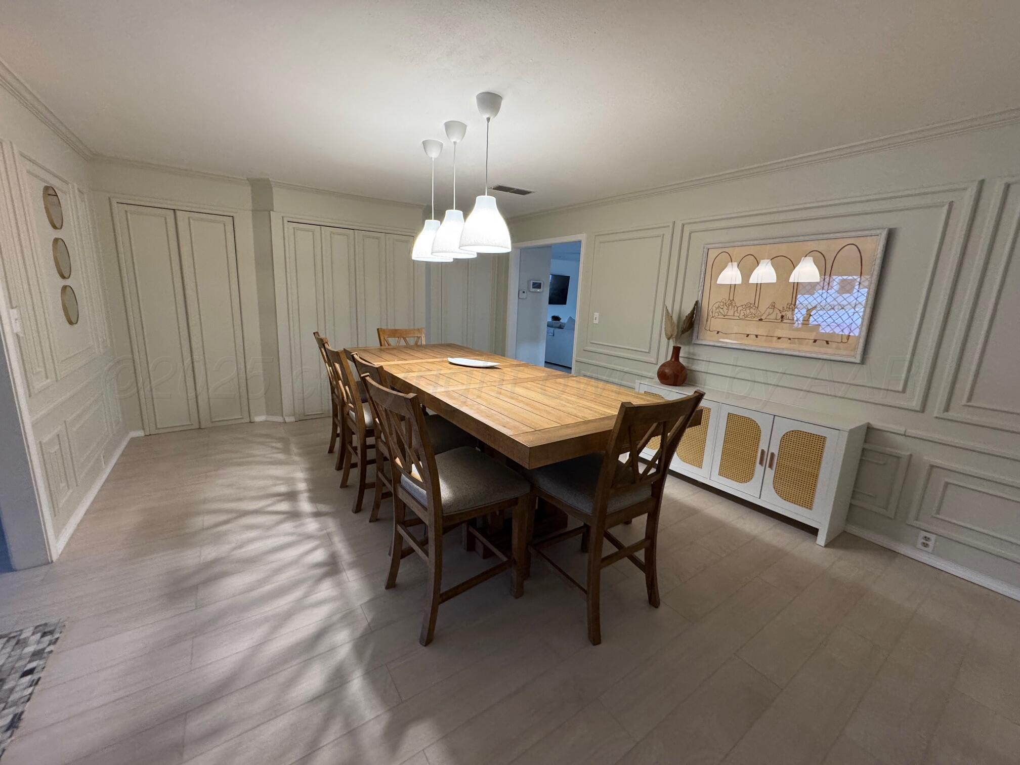 513 South Eton Street Perryton, TX 79070 - Photo 19 of 72 a dining room with furniture and window